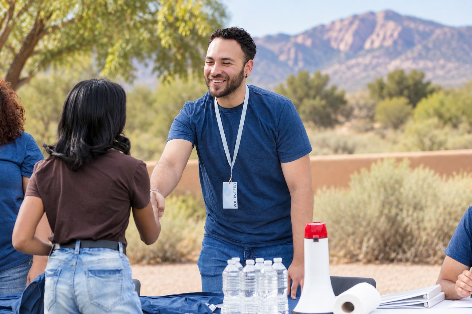 A community partner helping older adults at a table